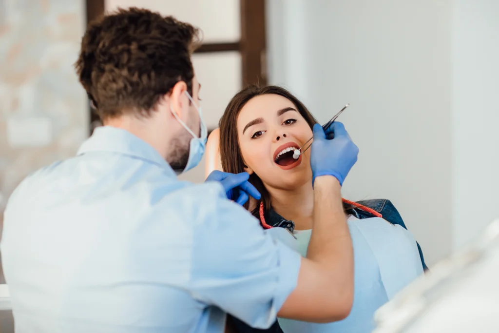 Dr. Avi Tandon, an aesthetic specialist, providing a gentle consultation to a patient at Tandon Dental Studio, the leading Dentist in Gurgaon (Guraon).